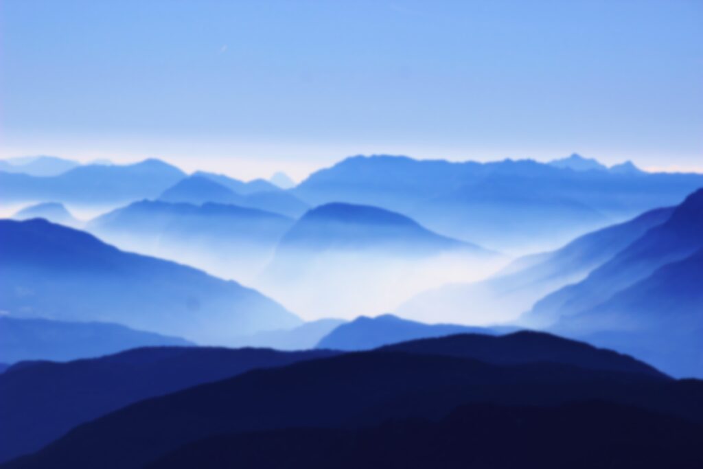 A view of the mountains in blue and white.